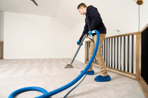 employee cleaning carpet