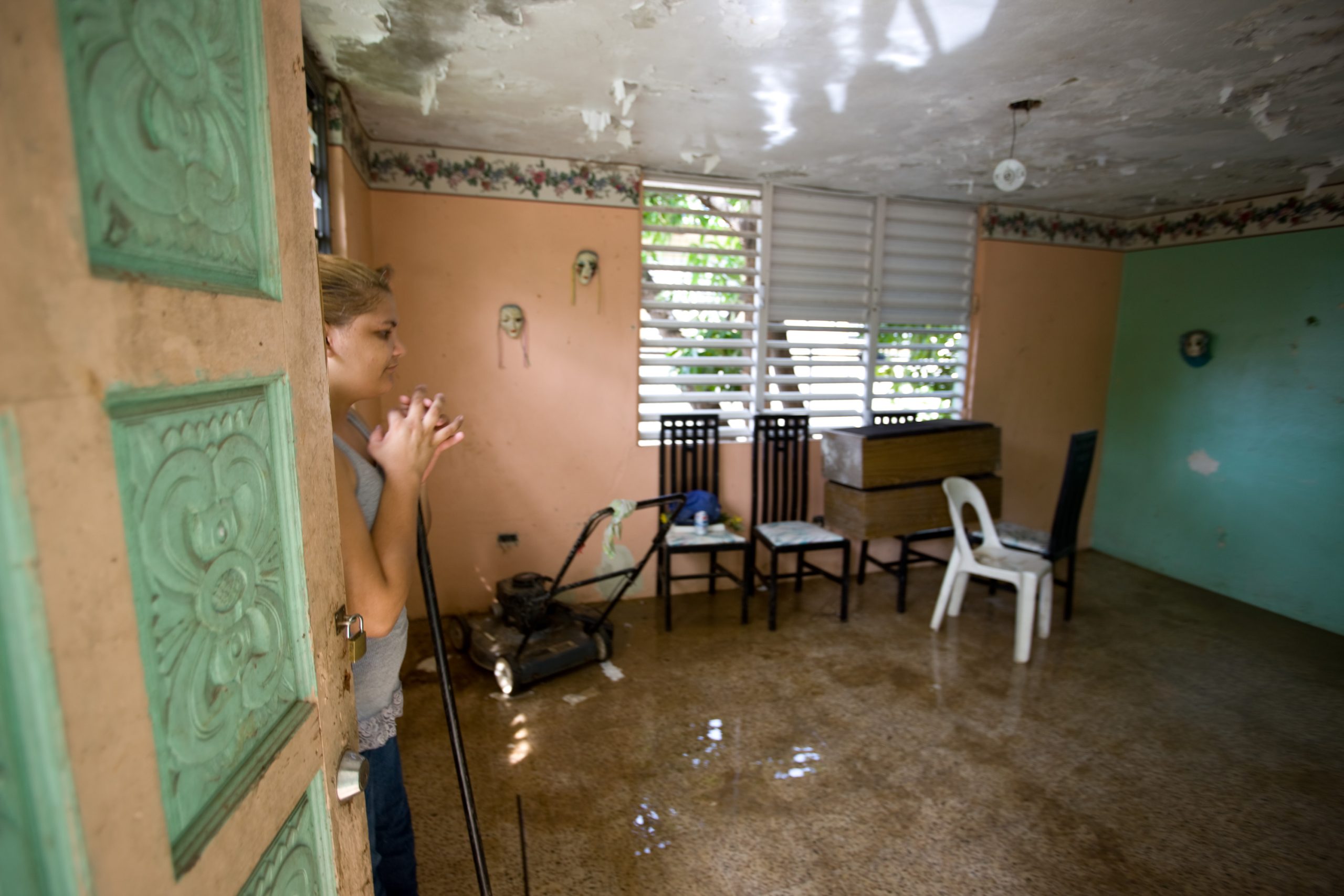 Flooded home interior with standing water. FEMA photo, public domain.