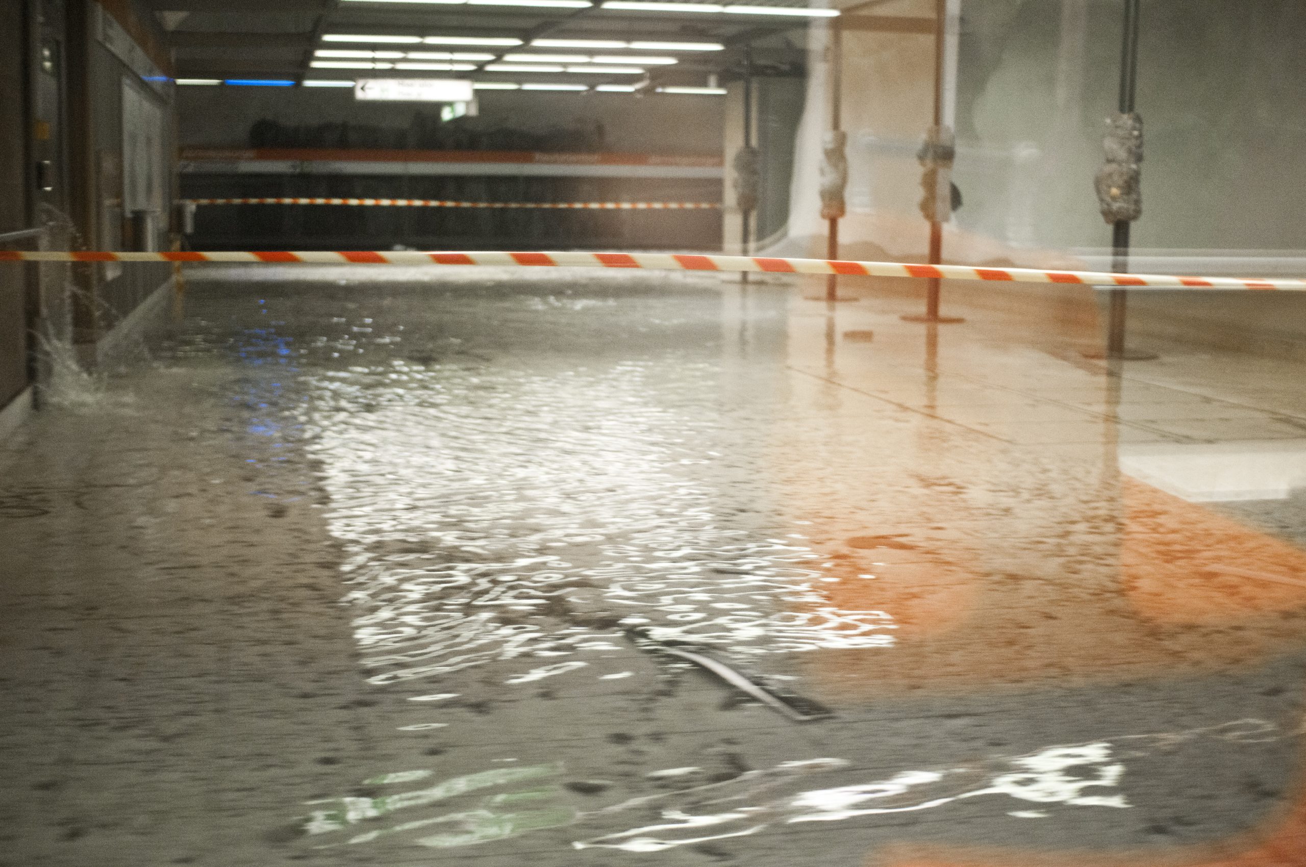 Standing water across a flooded commercial basement before water extraction